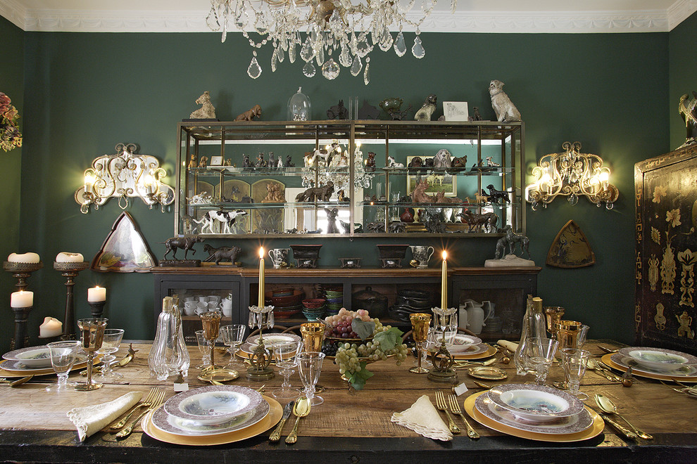Bohemian enclosed dining room in Venice with green walls.