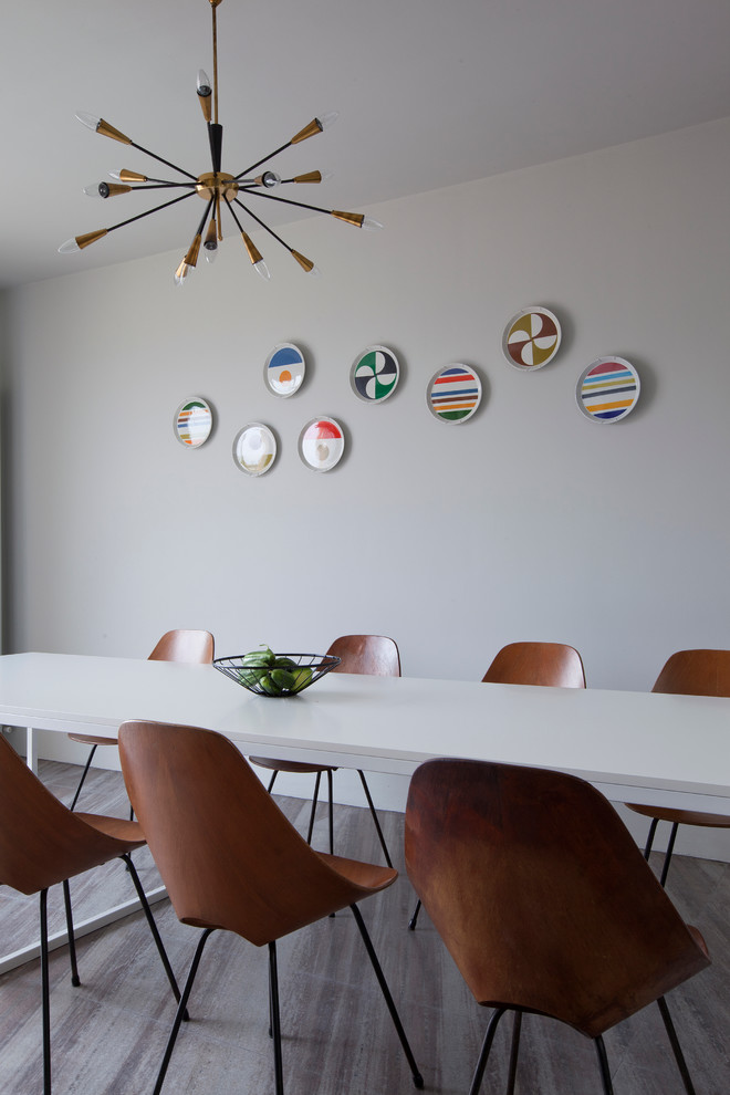 Design ideas for a medium sized midcentury dining room in Milan with white walls and marble flooring.