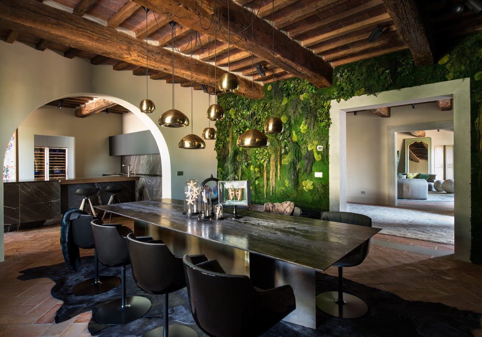 Large farmhouse enclosed dining room in Florence with green walls, brick flooring and red floors.