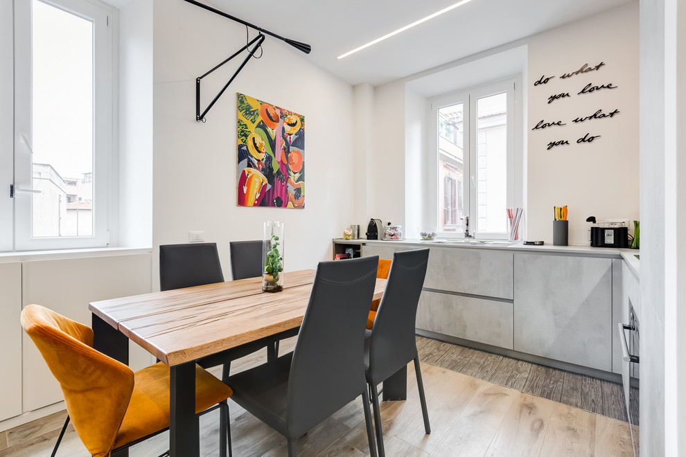 Свежая идея для дизайна: кухня-столовая среднего размера в современном стиле с белыми стенами и полом из керамогранита - отличное фото интерьера
