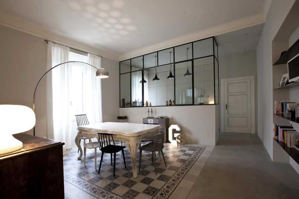 Photo of a dining room in Milan with feature lighting.