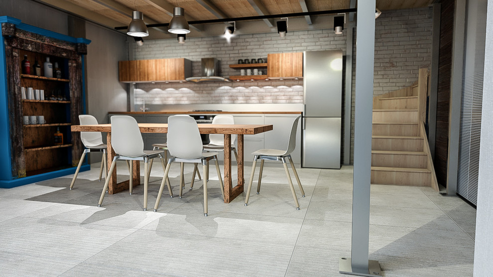 Idee per una grande sala da pranzo aperta verso il soggiorno industriale con pavimento in gres porcellanato e pavimento bianco