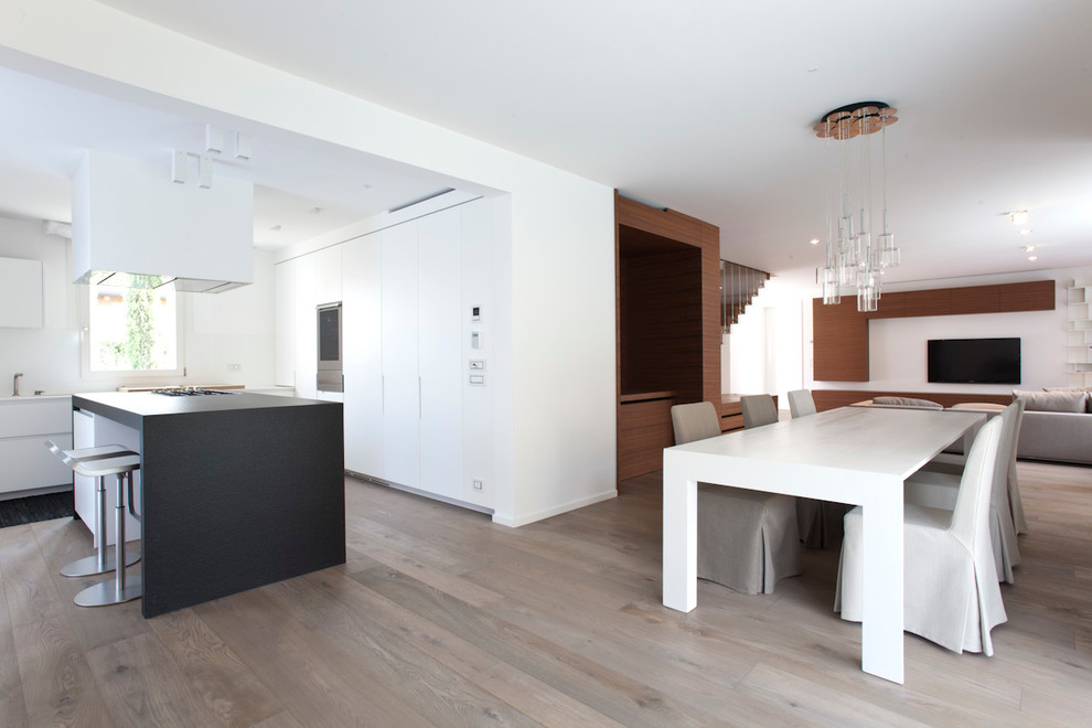 This is an example of a contemporary dining room in Venice.