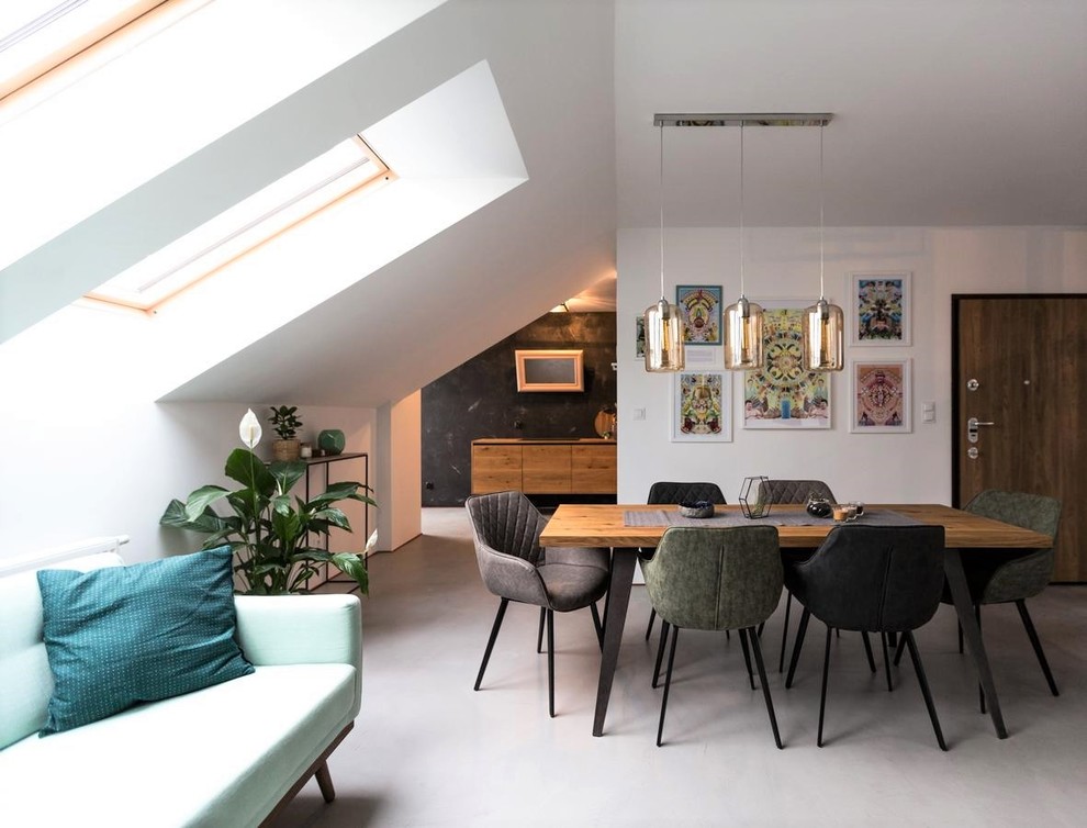 Idee per una sala da pranzo aperta verso il soggiorno minimal con pareti bianche e pavimento grigio