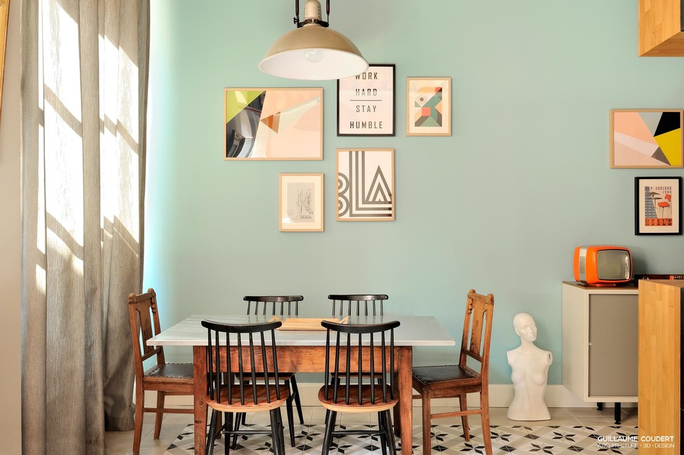 Medium sized scandi dining room in Lyon with blue walls.
