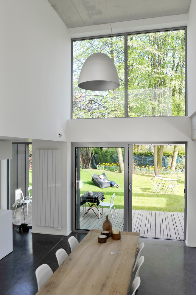 Design ideas for a medium sized contemporary open plan dining room in Lille with white walls.