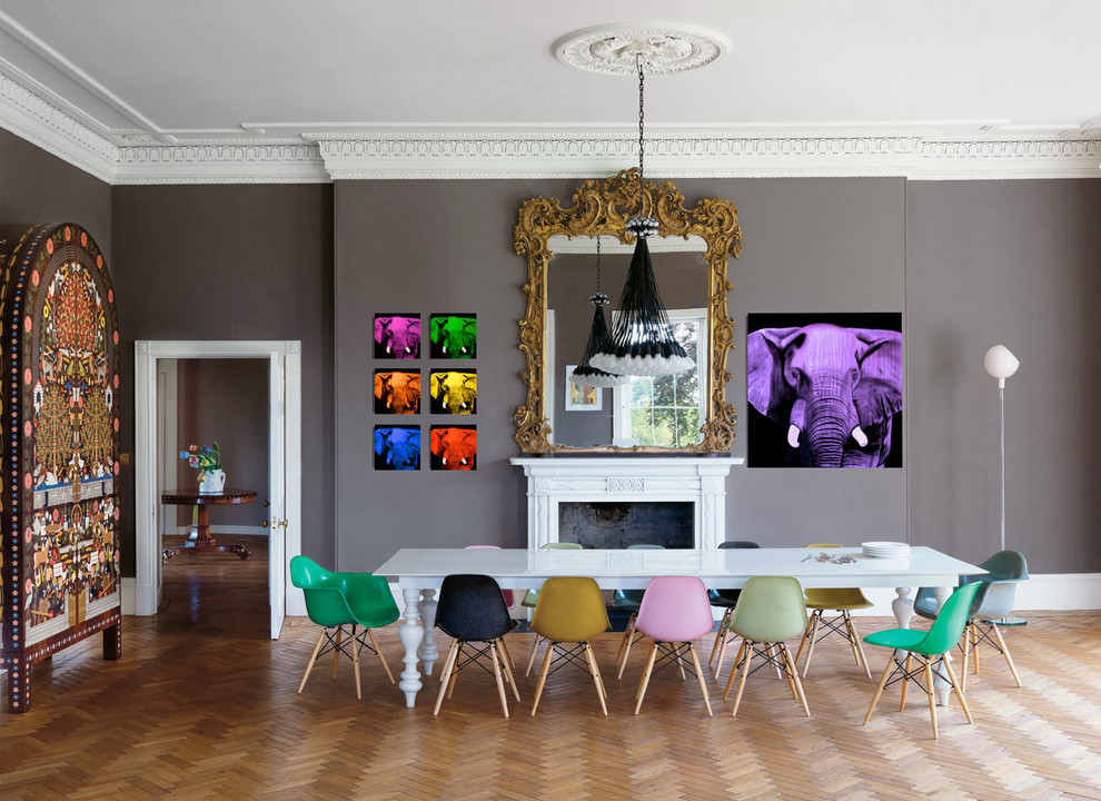 Huge trendy medium tone wood floor enclosed dining room photo in Bordeaux with gray walls