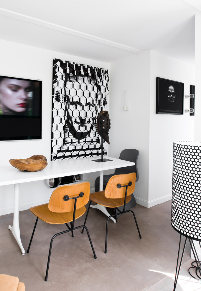 Foto di una sala da pranzo aperta verso il soggiorno design con pareti bianche