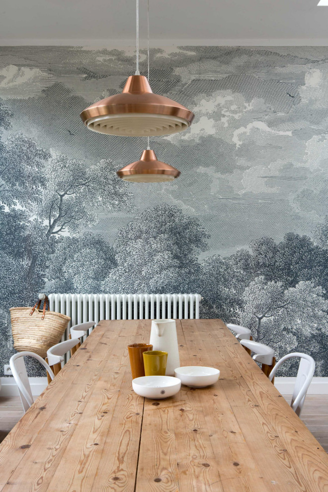 Medium sized contemporary dining room in Paris with grey walls, beige floors and wallpapered walls.