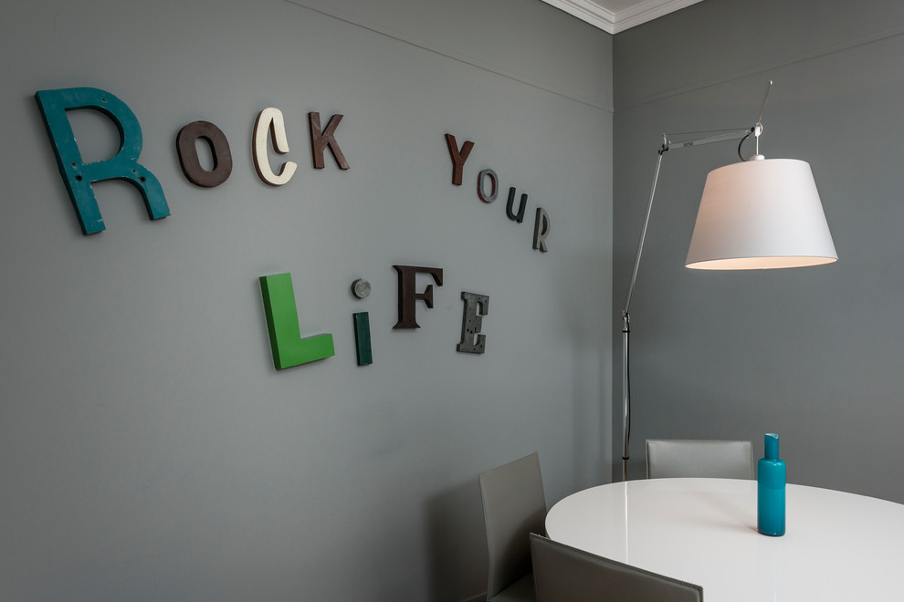 Dining room - contemporary light wood floor dining room idea in Paris with gray walls
