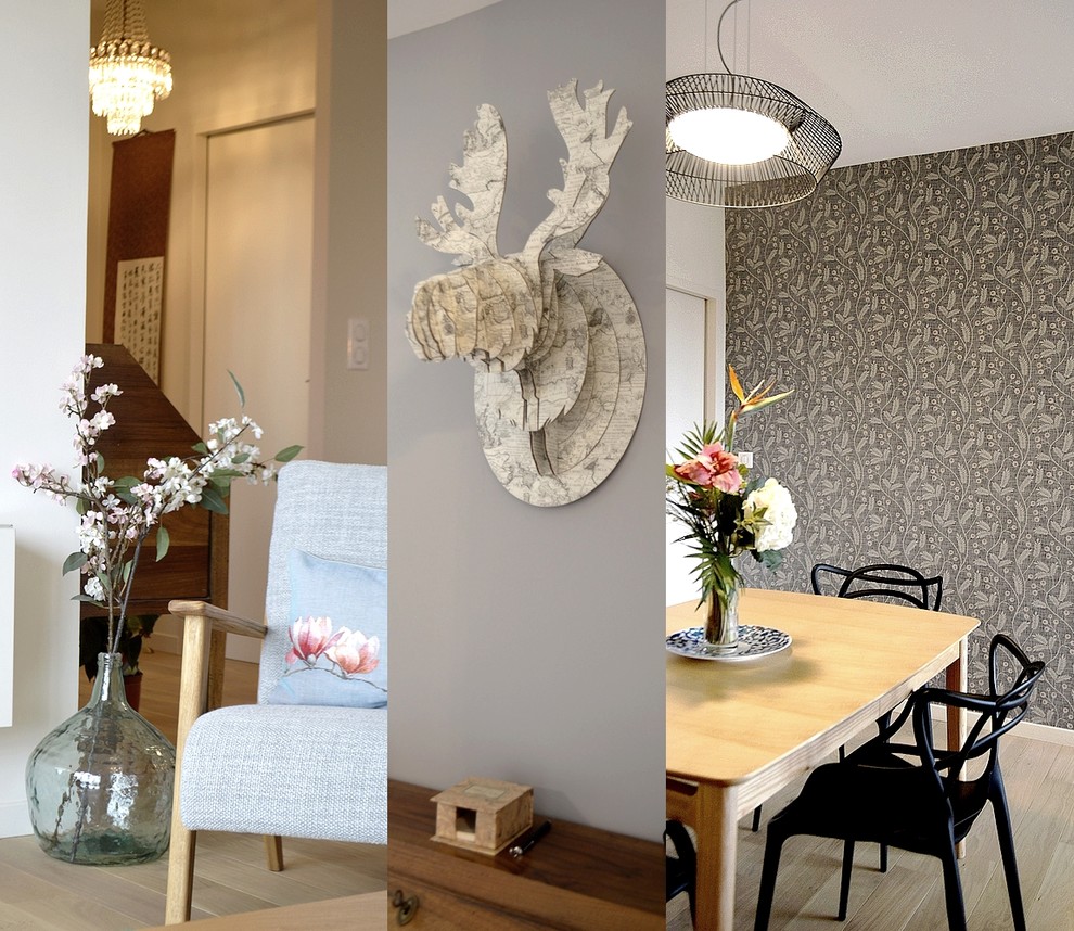 Inspiration pour une salle à manger ouverte sur le salon design de taille moyenne avec un mur gris, parquet clair et un sol beige.