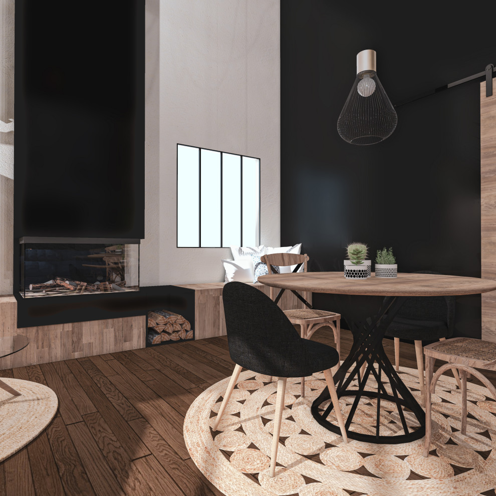 Medium sized industrial dining room in Lyon with black walls, dark hardwood flooring, a standard fireplace, a metal fireplace surround, brown floors and brick walls.