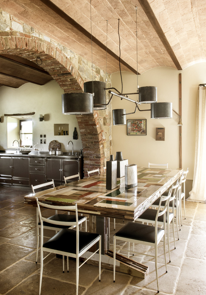 Inspiration for a farmhouse dining room in Paris with beige walls.