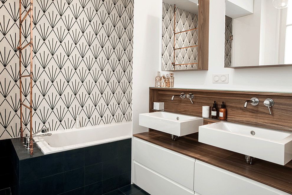 Design ideas for a medium sized contemporary ensuite bathroom in Paris with white cabinets, a submerged bath, an alcove shower, multi-coloured tiles, cement tiles, white walls, cement flooring, a wall-mounted sink, wooden worktops, blue floors and an open shower.