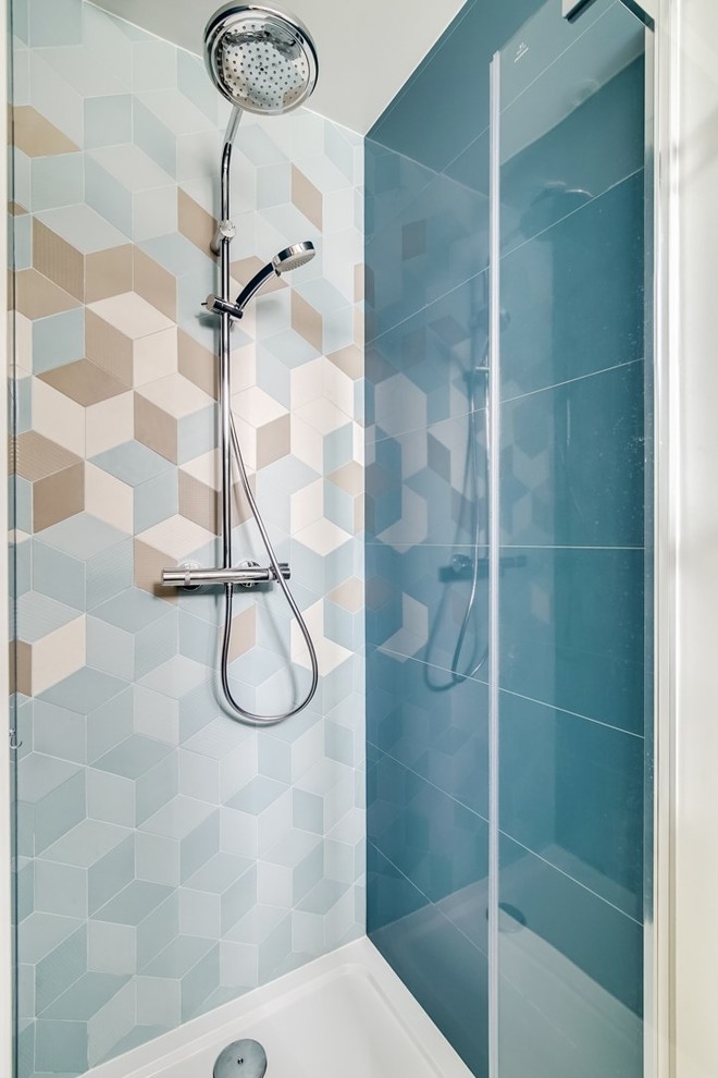 Walk-in shower - mid-sized scandinavian 3/4 blue tile and ceramic tile mosaic tile floor and beige floor walk-in shower idea in Paris with beaded inset cabinets, blue cabinets, blue walls and a hinged shower door