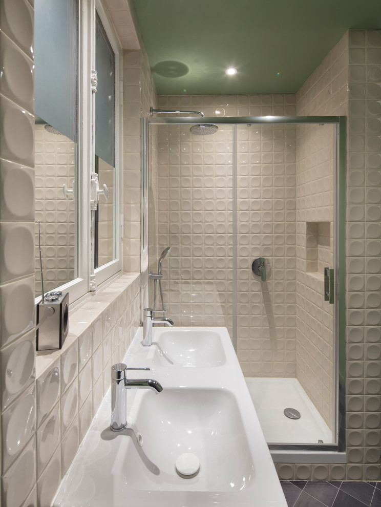 Design ideas for a medium sized contemporary ensuite bathroom in Paris with an alcove shower, white tiles, blue tiles, grey tiles, porcelain flooring, tiled worktops, blue floors, a sliding door and white worktops.