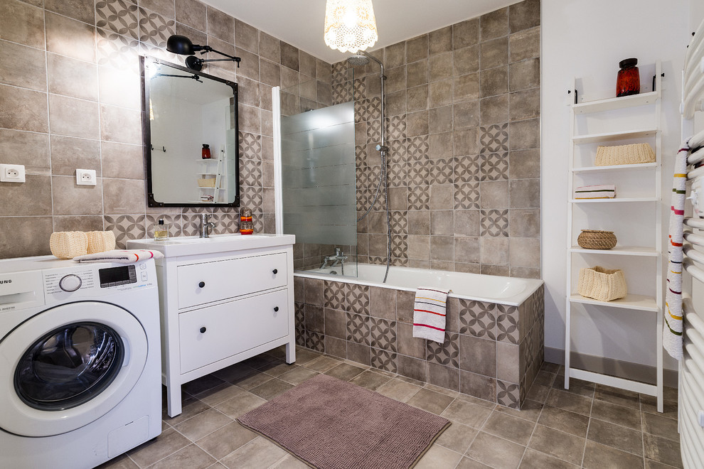 Medium sized farmhouse ensuite bathroom in Paris with a submerged bath, a shower/bath combination, beige tiles, cement tiles, beige walls, cement flooring, a trough sink, beige floors and a hinged door.