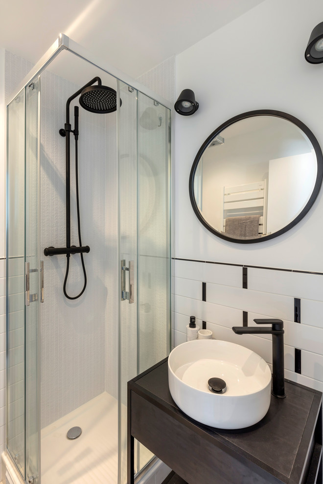 Photo of a small traditional shower room bathroom in Paris with a corner shower, a wall mounted toilet, white tiles, ceramic tiles, white walls, ceramic flooring, a vessel sink, wooden worktops, white floors, a sliding door and black worktops.