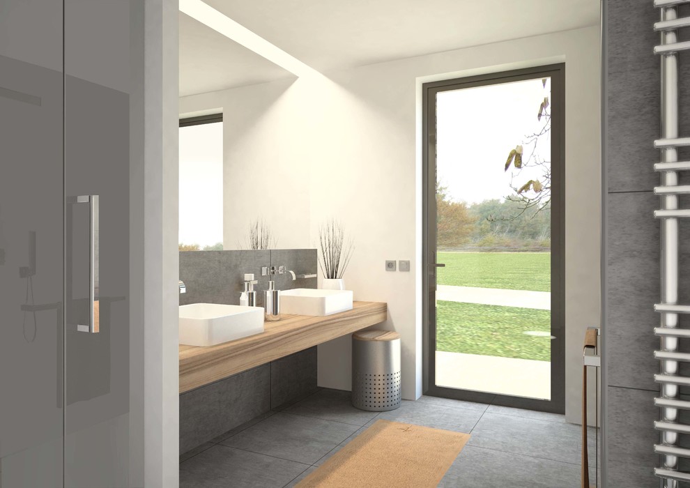 Aménagement d'une petite salle d'eau contemporaine avec une douche à l'italienne et un carrelage gris.