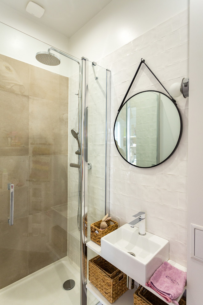 Example of a small trendy 3/4 white tile and ceramic tile ceramic tile and gray floor walk-in shower design in Paris with open cabinets, white cabinets, white walls, a drop-in sink, laminate countertops, a hinged shower door and white countertops