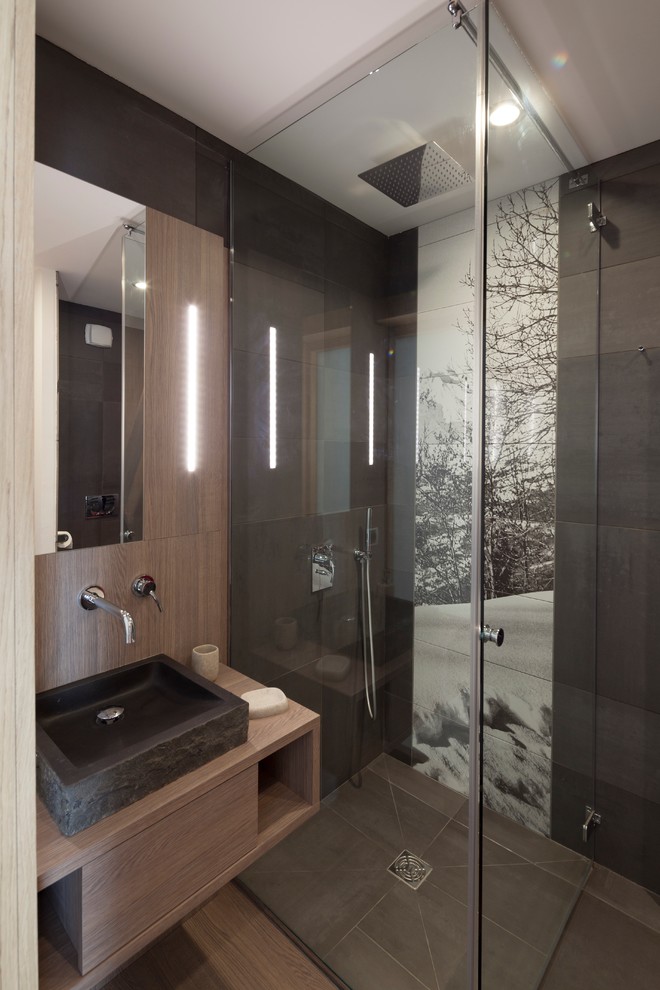 Inspiration for a small rustic shower room bathroom in Paris with medium wood cabinets, a corner shower, brown tiles, brown walls, medium hardwood flooring, a vessel sink, wooden worktops and brown worktops.