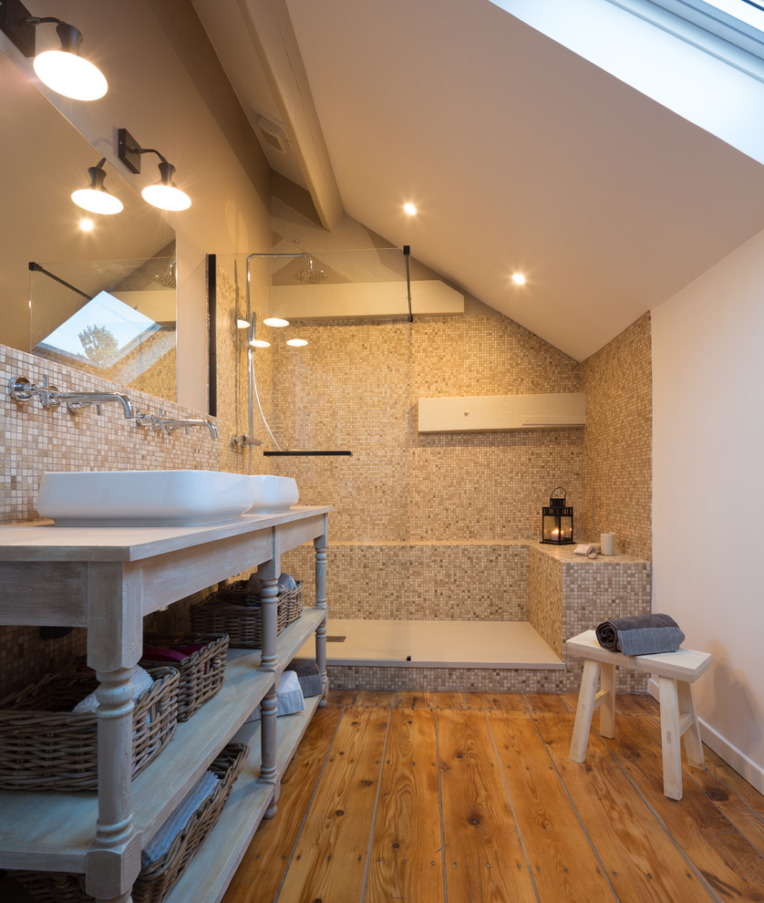Traditional bathroom in Paris with open cabinets, an alcove shower, beige tiles, mosaic tiles, white walls, medium hardwood flooring, a vessel sink, wooden worktops, brown floors, an open shower and grey worktops.