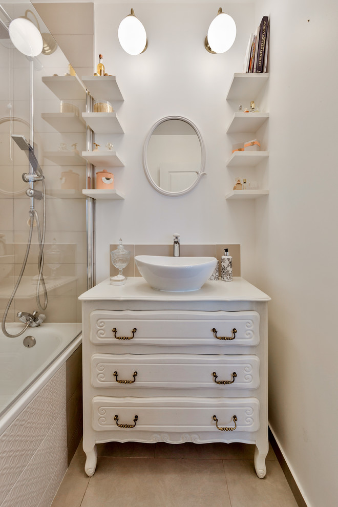This is an example of a small shabby-chic style ensuite bathroom in Paris with beige cabinets, a corner bath, a shower/bath combination, white tiles, porcelain tiles, white walls, ceramic flooring, a built-in sink, wooden worktops, beige floors, an open shower and white worktops.