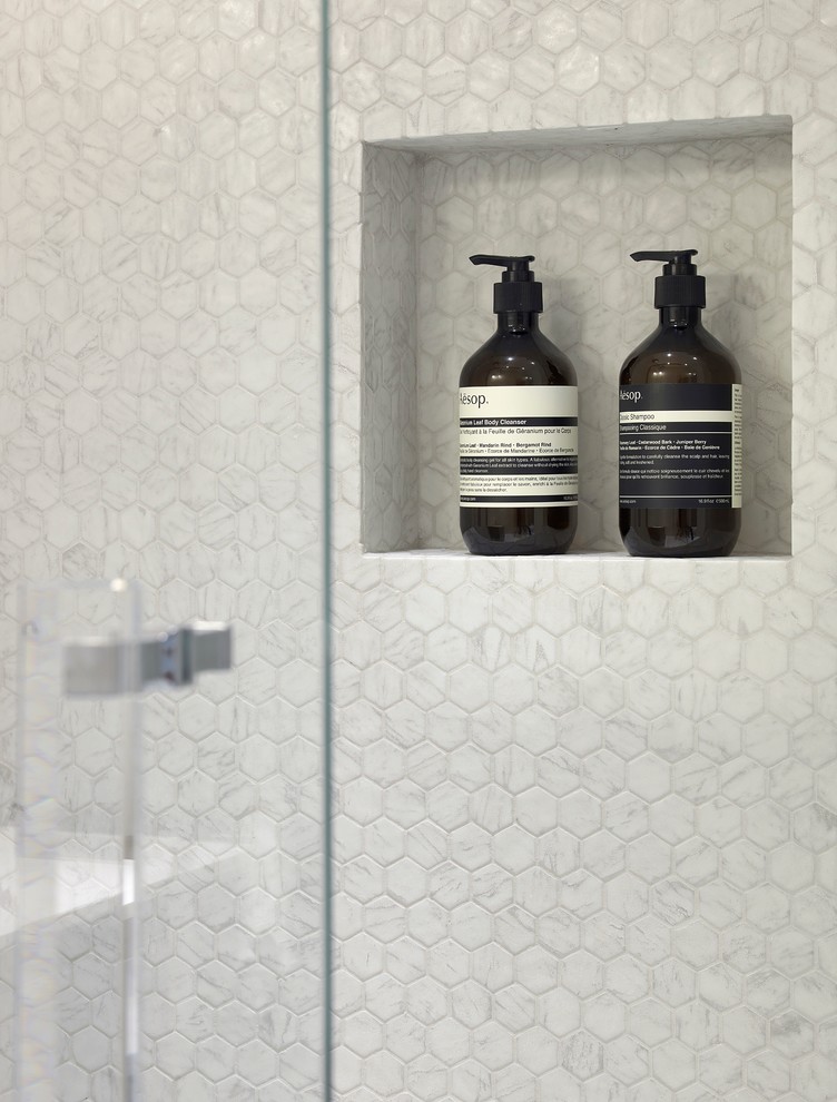 Inspiration for a mid-sized modern 3/4 white tile and mosaic tile marble floor walk-in shower remodel in Paris with beaded inset cabinets, blue cabinets, a wall-mount toilet, white walls, a wall-mount sink and solid surface countertops