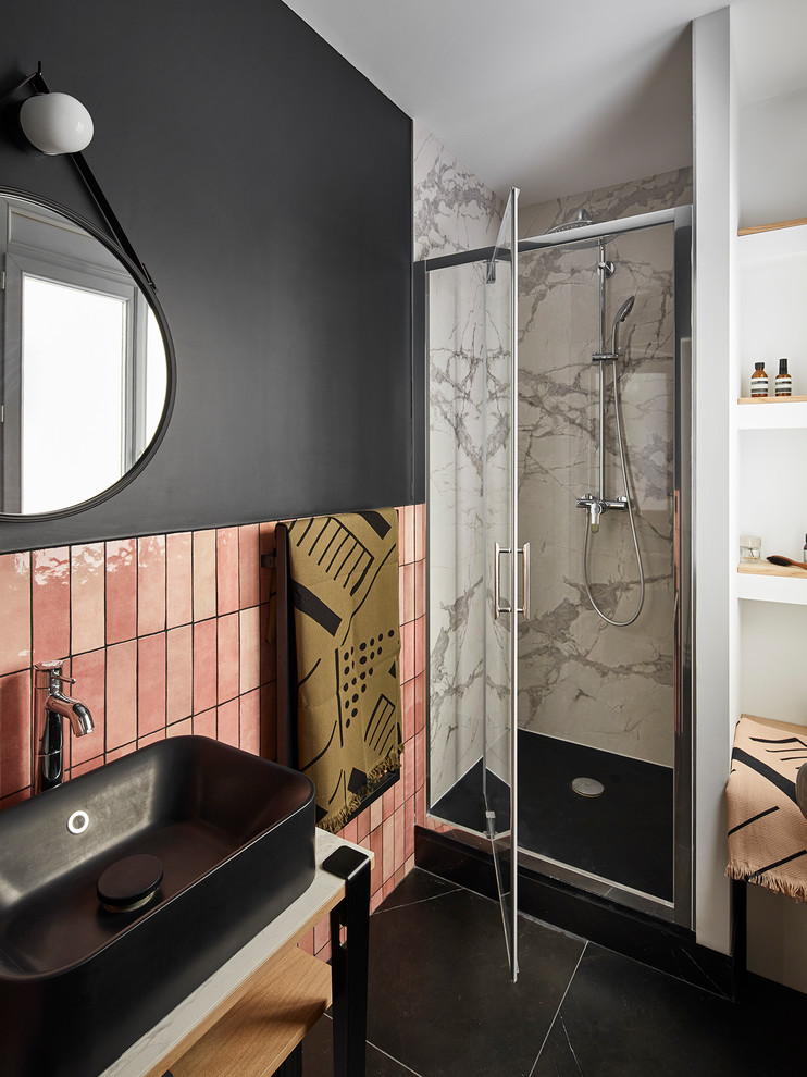 This is an example of a small contemporary shower room bathroom in Paris with open cabinets, an alcove shower, pink tiles, terracotta tiles, black walls, ceramic flooring, marble worktops, black floors, a hinged door, white worktops and a vessel sink.