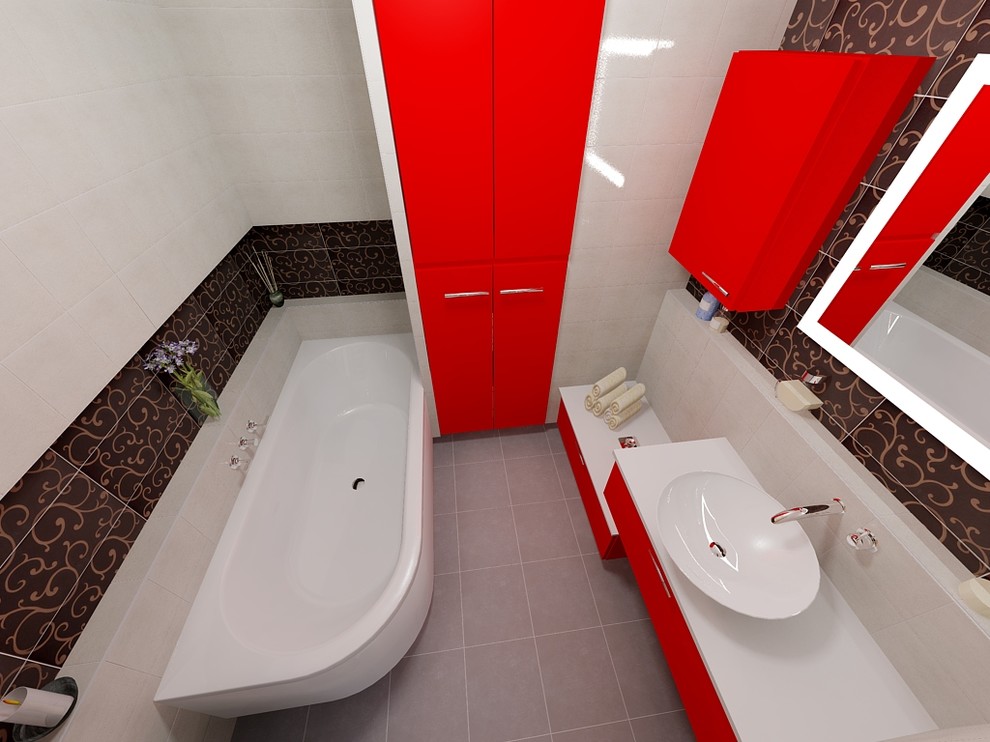 Cette image montre une petite salle de bain principale minimaliste avec une baignoire d'angle, un carrelage gris, un mur blanc et un plan vasque.