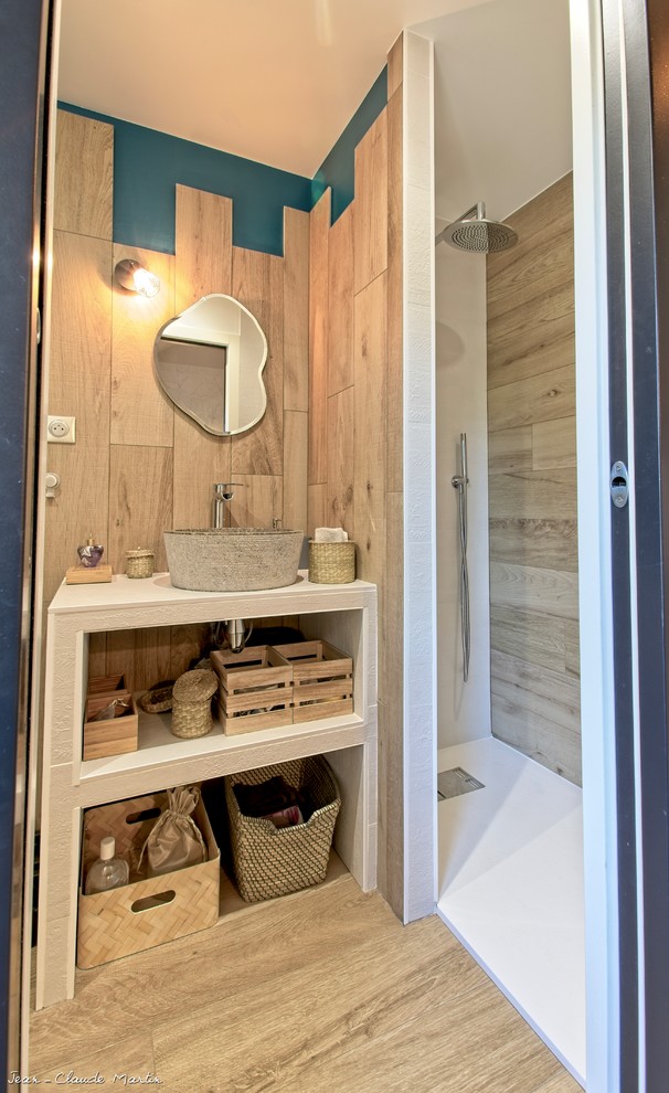 Inspiration for a small rustic shower room bathroom in Paris with open cabinets, a walk-in shower, a one-piece toilet, brown tiles, ceramic tiles, blue walls, ceramic flooring, a vessel sink, tiled worktops, brown floors, an open shower and white worktops.