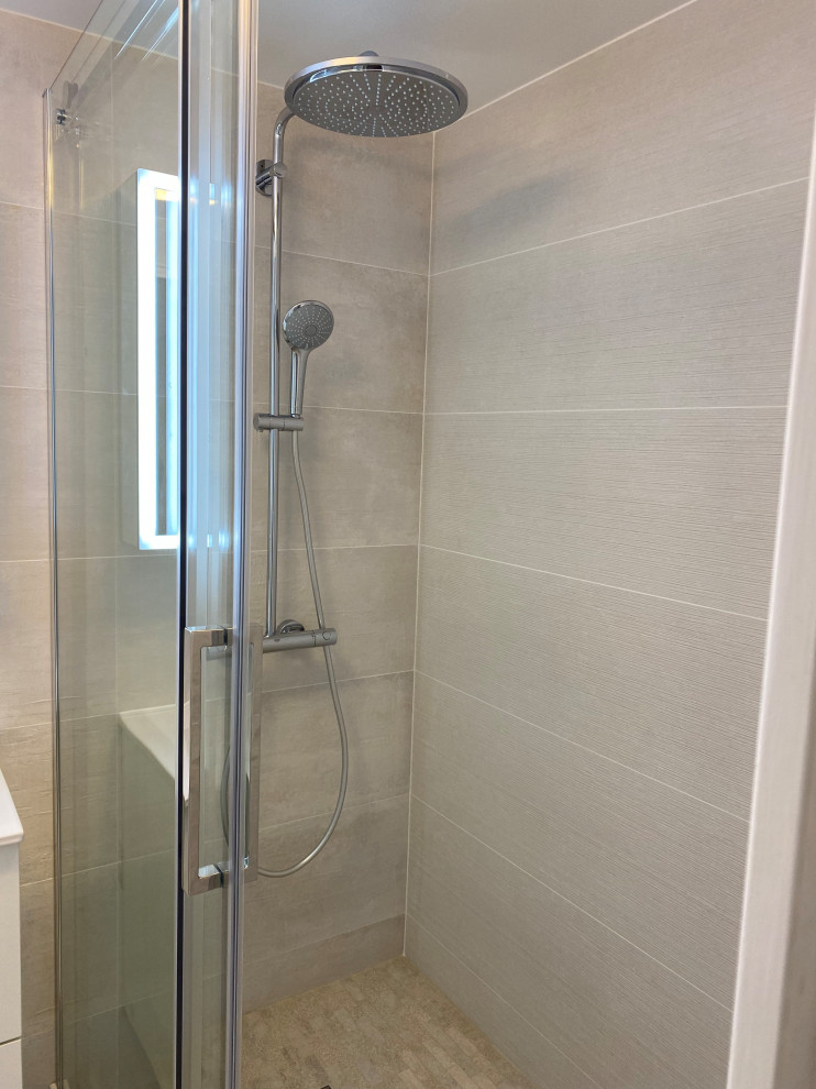 This is an example of a small modern ensuite bathroom in Nice with flat-panel cabinets, beige cabinets, a built-in shower, grey tiles, ceramic tiles, grey walls, ceramic flooring, a wall-mounted sink, engineered stone worktops, grey floors and white worktops.