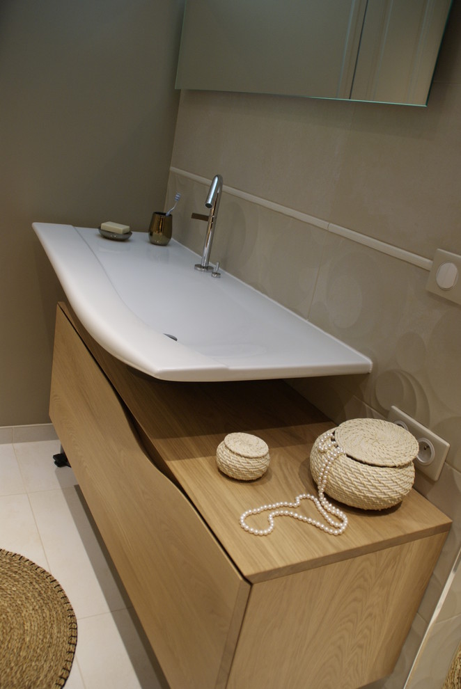 Photo of a medium sized traditional ensuite bathroom in Other with beaded cabinets, a walk-in shower, beige tiles, ceramic tiles, beige walls, ceramic flooring, a trough sink, marble worktops and white worktops.