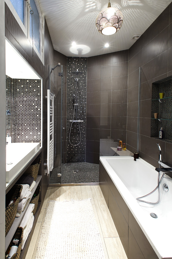 This is an example of a medium sized contemporary ensuite bathroom in Paris with open cabinets, brown cabinets, a built-in shower, brown tiles, ceramic tiles, brown walls, light hardwood flooring, a trough sink, solid surface worktops, beige floors and a hinged door.
