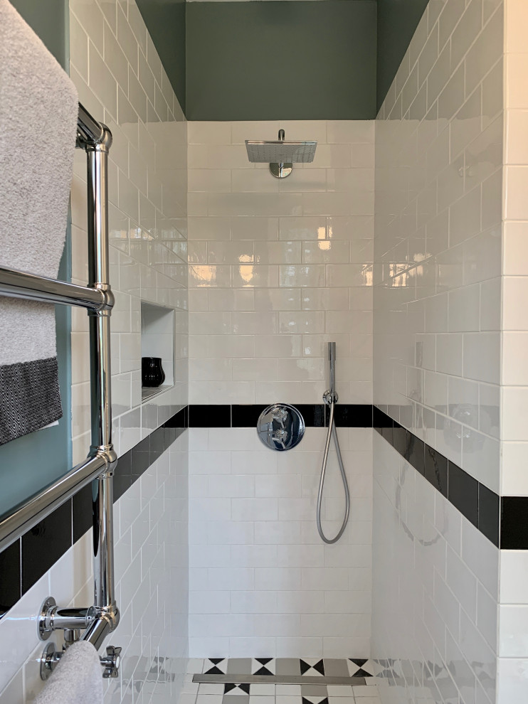 Small midcentury shower room bathroom in Other with beaded cabinets, white cabinets, a built-in shower, a wall mounted toilet, white tiles, metro tiles, blue walls, ceramic flooring, a vessel sink, limestone worktops, white floors, an open shower and white worktops.