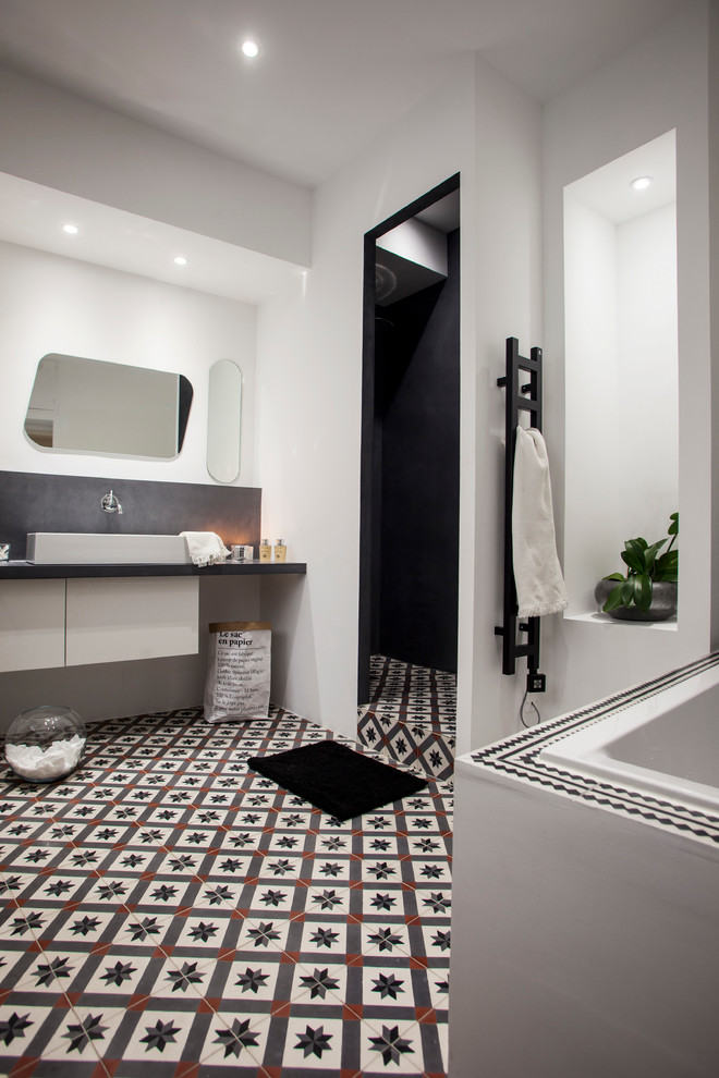 Inspiration for a small contemporary master white tile, gray tile, brown tile, black tile, black and white tile and cement tile cement tile floor walk-in shower remodel in Marseille with flat-panel cabinets, white cabinets, a hot tub, white walls and a drop-in sink