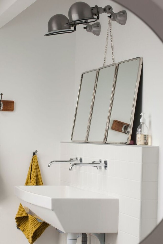 Large urban kids' bathroom photo in Lyon with open cabinets, white walls, a trough sink and brown countertops