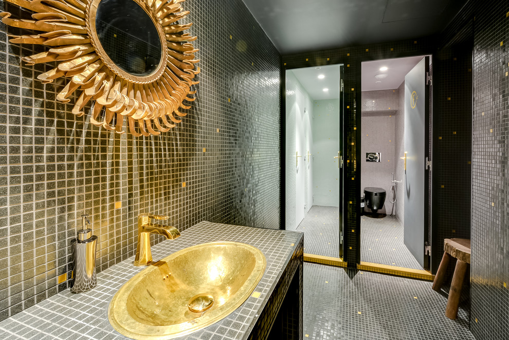 Large contemporary shower room bathroom in Paris with a built-in sink, a submerged sink, a wall mounted toilet, black tiles, black walls, a double shower, mosaic tiles and mosaic tile flooring.