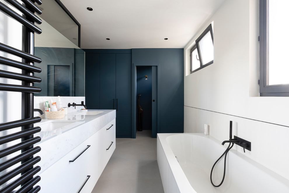 Inspiration for a medium sized contemporary ensuite bathroom in Paris with a built-in bath, a built-in shower, white tiles, white walls, a submerged sink, white floors and an open shower.