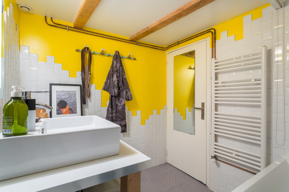 Bohemian ensuite bathroom in Lyon with a submerged bath and metro tiles.