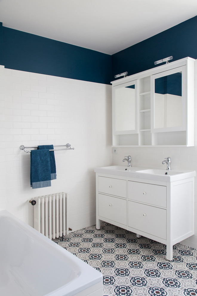 Inspiration for a medium sized contemporary ensuite bathroom in Paris with a submerged bath, a built-in shower, white tiles, terracotta tiles, white walls, terracotta flooring, a console sink, tiled worktops, blue floors, an open shower and white worktops.