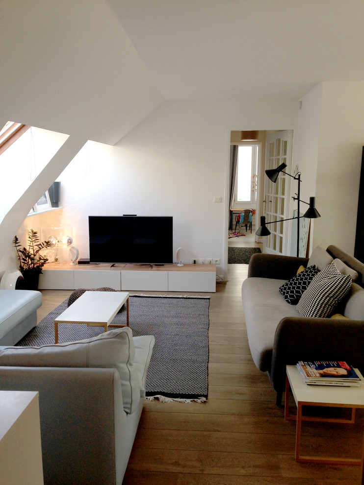 Example of a mid-sized danish family room design in Paris