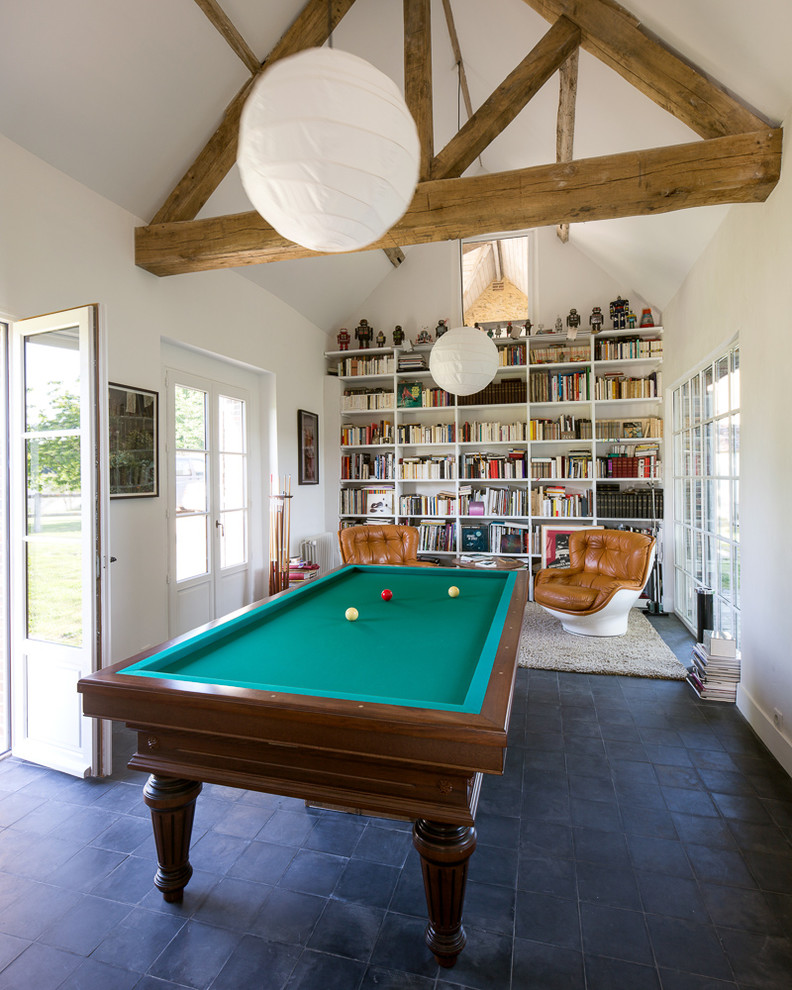 Large country enclosed games room in Other with white walls, ceramic flooring, no fireplace and no tv.