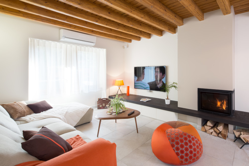 Inspiration for a medium sized rural open plan games room in Lyon with white walls, a corner fireplace, a wall mounted tv, ceramic flooring and a metal fireplace surround.