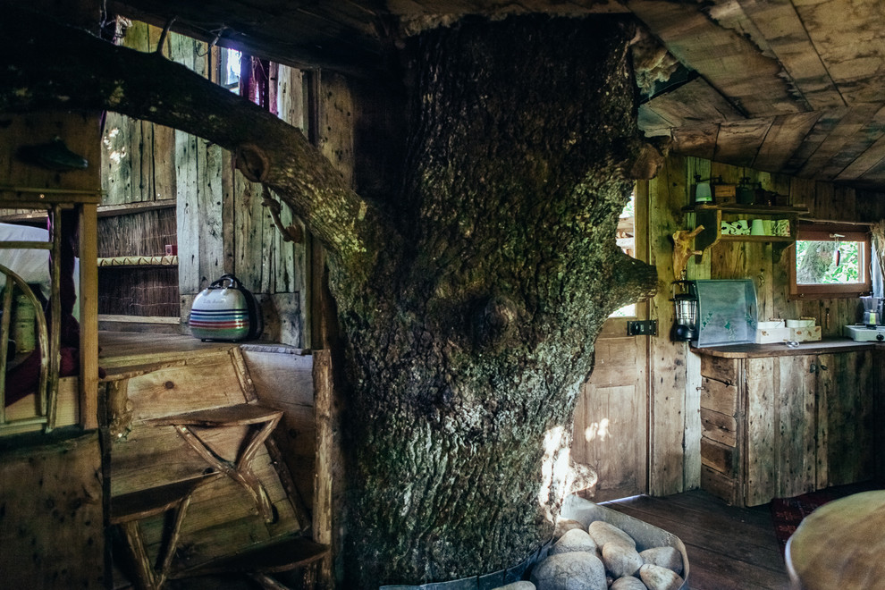This is an example of a rustic games room in Other.