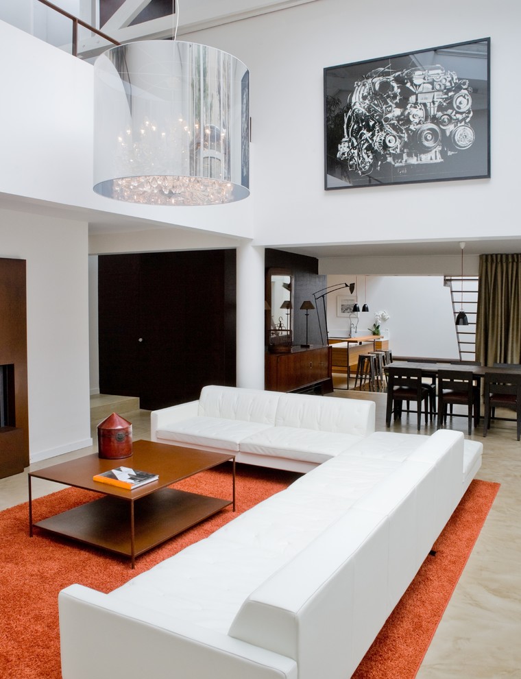 Ispirazione per un grande soggiorno design stile loft con pareti bianche e pavimento in cemento