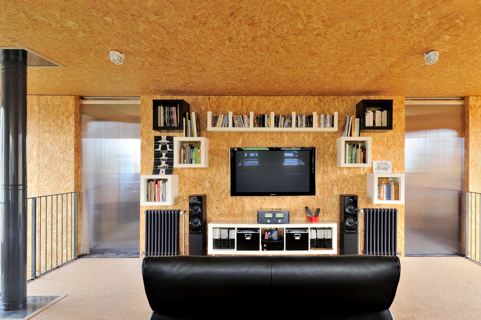 This is an example of a medium sized industrial mezzanine games room in Lyon with beige walls, plywood flooring, a wall mounted tv and no fireplace.