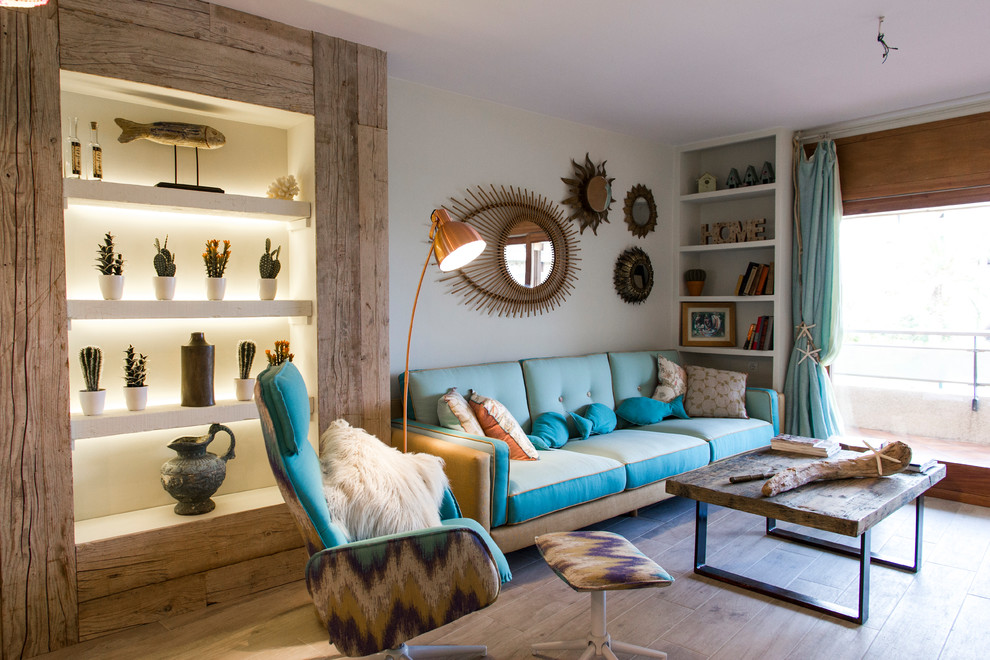 Inspiration for a coastal formal and enclosed medium tone wood floor and beige floor living room remodel in Other with gray walls