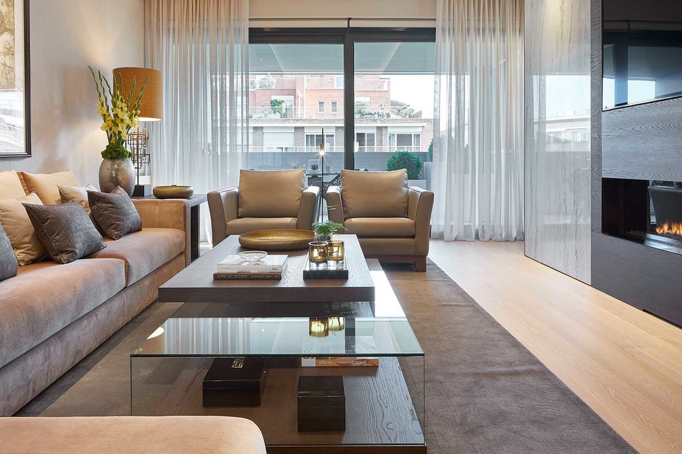 Large contemporary open plan living room in Madrid with a home bar and a ribbon fireplace.