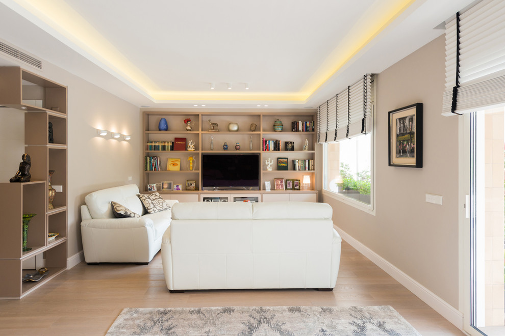 Mid-sized minimalist formal and open concept medium tone wood floor living room photo in Barcelona with beige walls, no fireplace and a tv stand
